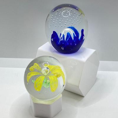 LOT 164: Pair of Glass Paperweights - Yellow Flower and Blue Abstract