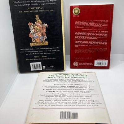 LOT 167: Pair of Carved Stone Bookends with Collection of Books