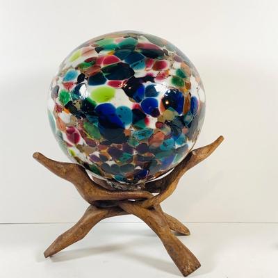 LOT 190: Beautiful Multicolored Blown Glass Orb on Driftwood Base