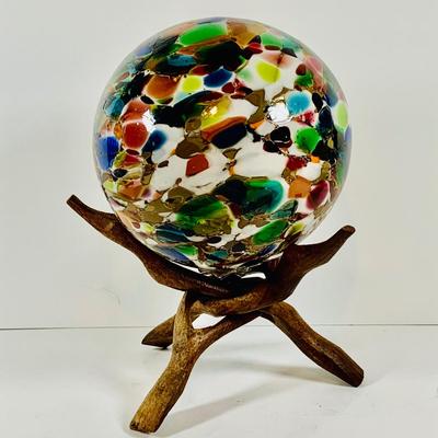 LOT 190: Beautiful Multicolored Blown Glass Orb on Driftwood Base