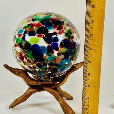 LOT 190: Beautiful Multicolored Blown Glass Orb on Driftwood Base