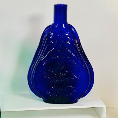 LOT 192: Blenko Glass Bottle, Two (2) Clevenger Bros. Glass Bottles, and a Glass Apple Paperweight