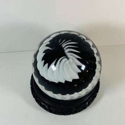 LOT 193: Black and White Paperweight with Wood Base
