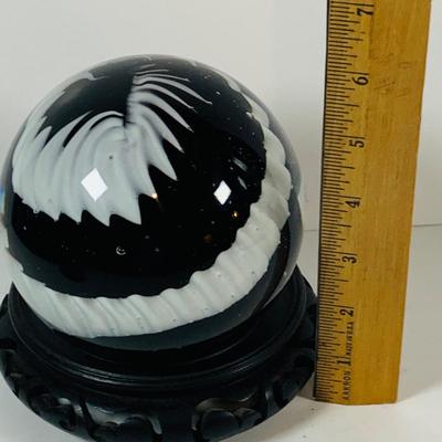 LOT 193: Black and White Paperweight with Wood Base