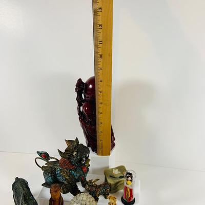 LOT 197: Asia Inspired Collection Including Peking Opera Facial Make-up Plaque, Wooden Figures, Miniture Doll. Buddha's, Dragons and...