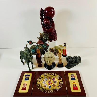 LOT 197: Asia Inspired Collection Including Peking Opera Facial Make-up Plaque, Wooden Figures, Miniture Doll. Buddha's, Dragons and...