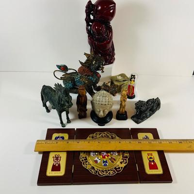 LOT 197: Asia Inspired Collection Including Peking Opera Facial Make-up Plaque, Wooden Figures, Miniture Doll. Buddha's, Dragons and...