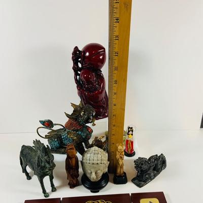 LOT 197: Asia Inspired Collection Including Peking Opera Facial Make-up Plaque, Wooden Figures, Miniture Doll. Buddha's, Dragons and...
