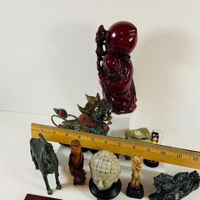 LOT 197: Asia Inspired Collection Including Peking Opera Facial Make-up Plaque, Wooden Figures, Miniture Doll. Buddha's, Dragons and...
