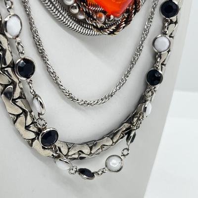 LOT 239: Silvertone and Black Necklace Collection with Showstopper Giant Red Glass Heart Shaped Pendant