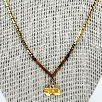 LOT 240J: 14K Yellow Gold Sun Oil Logo Charm Necklace with Diamond Chip