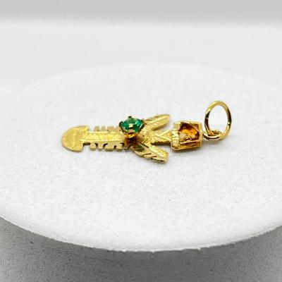 LOT 248J: 18K Yellow Gold and Emerald Chip Mayan Indian Sky God Charm - 0.7 GTW