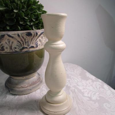 2 faux plants in decorative planters, 2 wood candlesticks, 1 decorative plate