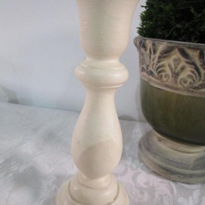 2 faux plants in decorative planters, 2 wood candlesticks, 1 decorative plate