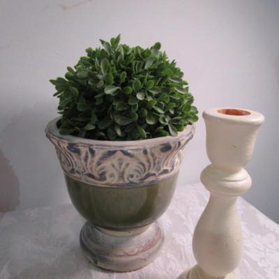 2 faux plants in decorative planters, 2 wood candlesticks, 1 decorative plate