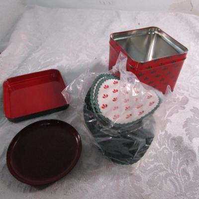 Christmas decorations, decorative wooden spoon, tin of paper coasters