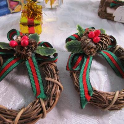 11 Christmas ornaments, 1 suction cup wreath holder, bird candle