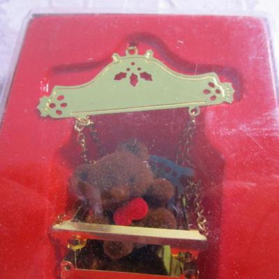 11 Christmas ornaments, 1 suction cup wreath holder, bird candle