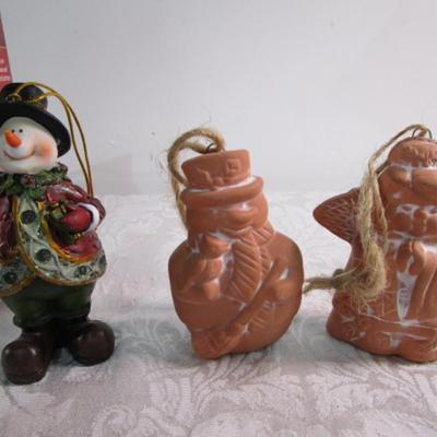 11 Christmas ornaments, 1 suction cup wreath holder, bird candle