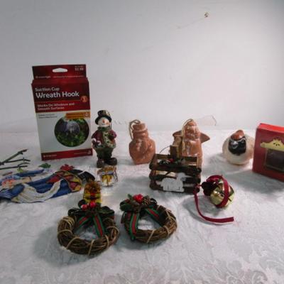 11 Christmas ornaments, 1 suction cup wreath holder, bird candle
