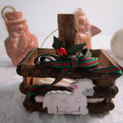 11 Christmas ornaments, 1 suction cup wreath holder, bird candle