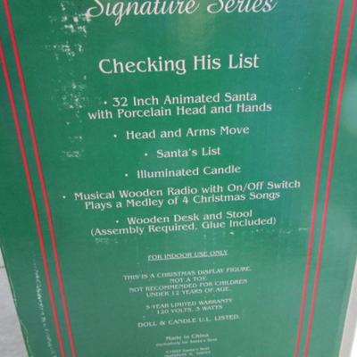 New in box Vintage Santa at the desk checking his list