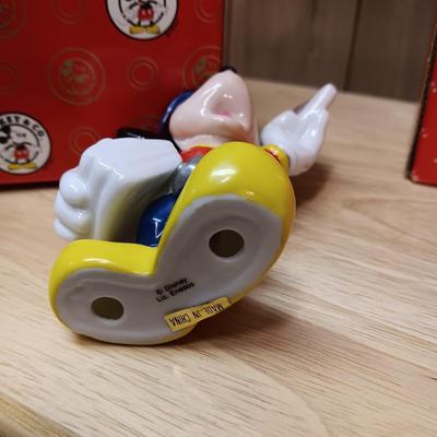 DISNEY CERAMIC FIGURINES AND MICKEY & MINNIE ON A MOVING SEESAW MUSIC BOX