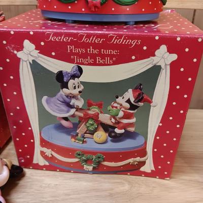 DISNEY CERAMIC FIGURINES AND MICKEY & MINNIE ON A MOVING SEESAW MUSIC BOX