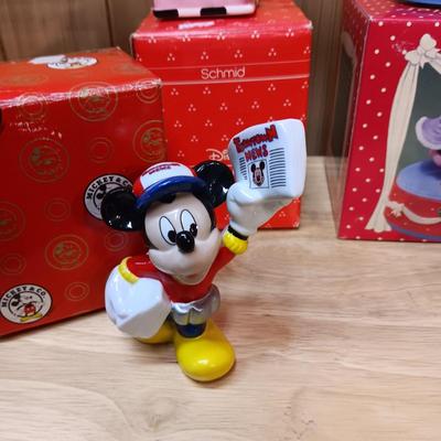 DISNEY CERAMIC FIGURINES AND MICKEY & MINNIE ON A MOVING SEESAW MUSIC BOX