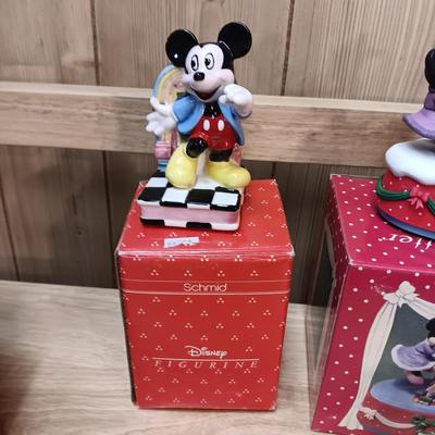 DISNEY CERAMIC FIGURINES AND MICKEY & MINNIE ON A MOVING SEESAW MUSIC BOX