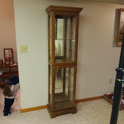 NARROW CURIO CABINET WITH A MIRRORED BACK