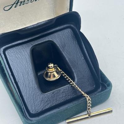 LOT 121J: Mobil Belt Buckle and Anson Tie Pin
