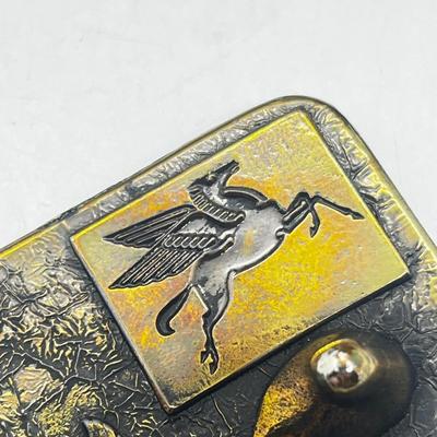 LOT 121J: Mobil Belt Buckle and Anson Tie Pin