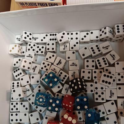 MANY CASINO DICE, POKER CHIPS AND A DECK OF CARDS