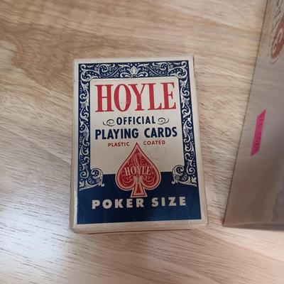 MANY CASINO DICE, POKER CHIPS AND A DECK OF CARDS