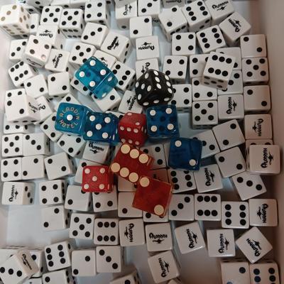 MANY CASINO DICE, POKER CHIPS AND A DECK OF CARDS