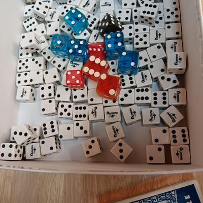 MANY CASINO DICE, POKER CHIPS AND A DECK OF CARDS