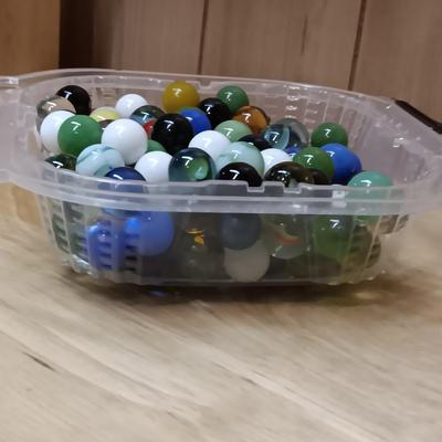 BOWL FULL OF MARBLES AND LEATHER STRAP ROLLER SKATES