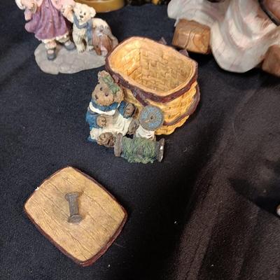 LARRGE GRANDMA IN A ROCKER AND VARIOUS FIGURINES SURROUNDING HER