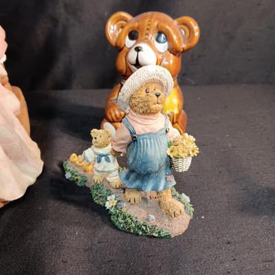 LARRGE GRANDMA IN A ROCKER AND VARIOUS FIGURINES SURROUNDING HER