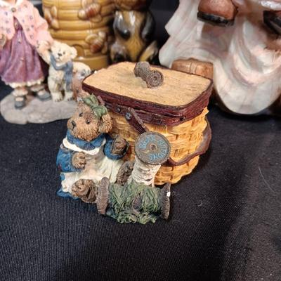 LARRGE GRANDMA IN A ROCKER AND VARIOUS FIGURINES SURROUNDING HER