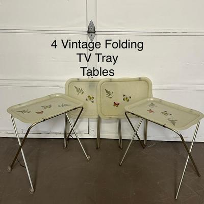 Sale Photo Thumbnail #105: Set of 4 vintage folding TV tray tables featuring classic fiberglass tops with metal legs, perfect for casual dining or retro décor.