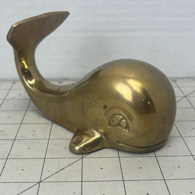 Sale Photo Thumbnail #274: Hump back Whale has a somewhat happy face with large etched eyes and mouth. It is very heavy and could be used as a paper weight.