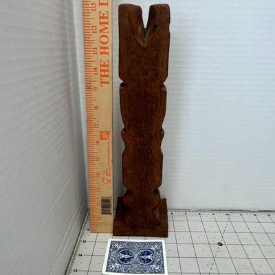 Sale Photo Thumbnail #323: Vintage hand-carved Alaskan Creed Totem from Anchorage, Alaska. This unique piece showcases traditional Native Alaskan artistry, featuring intricate details and rich cultural symbolism.
