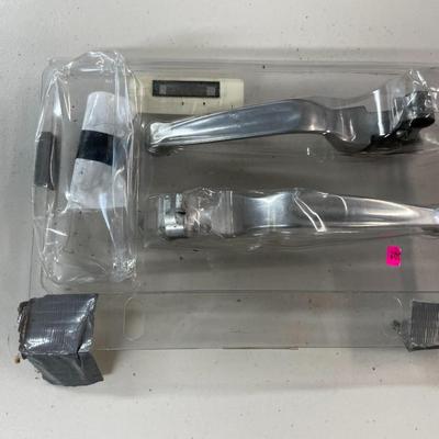 Two Chrome-Colored Motorcycle Levers