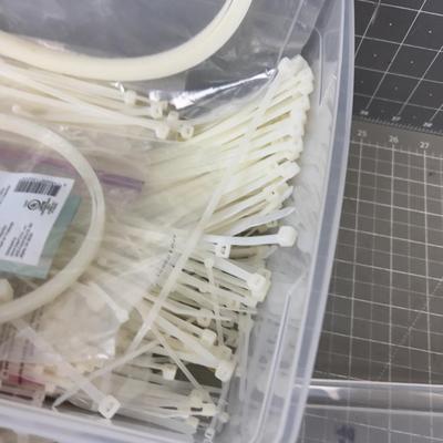 Tub full of Various Sizes of Cable / Zip Ties 