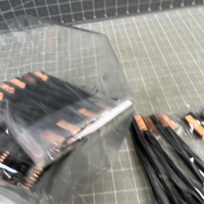 Tub full of brass brushes. (40) 