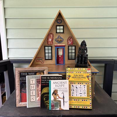 LOT 287: Handcrafted Egyptian A-Frame Style Doll House and Books