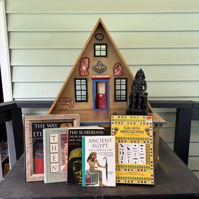 LOT 287: Handcrafted Egyptian A-Frame Style Doll House and Books