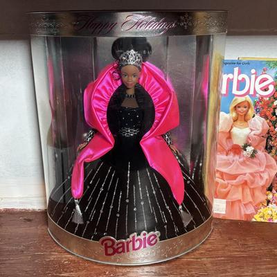 LOT 297: NIP 1998 Happy Holiday Barbie, 1985 Barbie Magazine & 1979 Sunshine Family Coloring Book